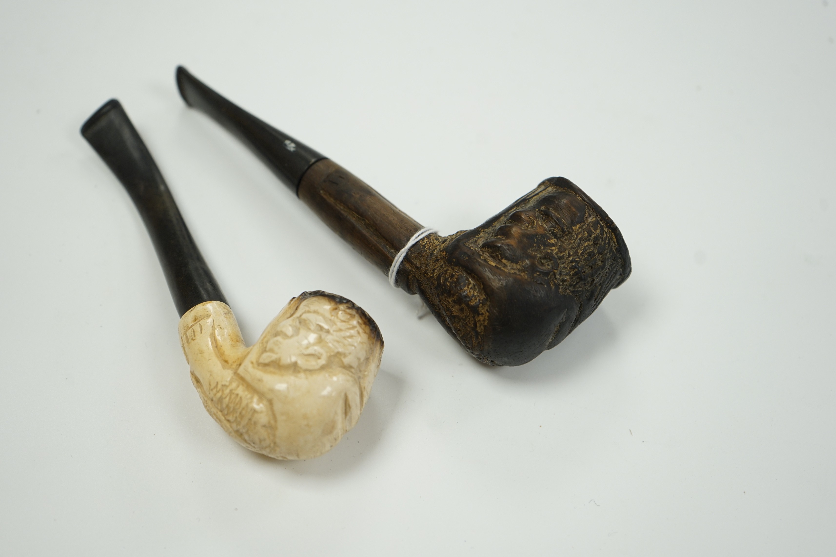 A Meerschaum pipe and an African ebony pipe